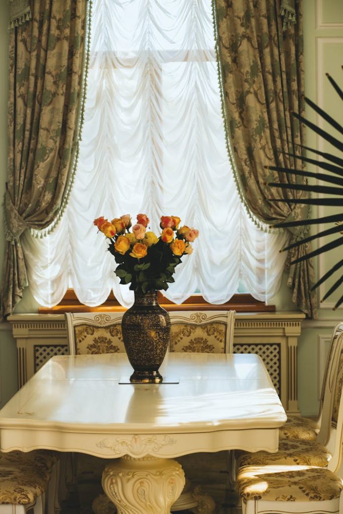 pexels-photo-1366879 Table Beside Window Curtain